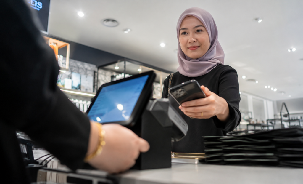 lady gives her phone to scan qr code