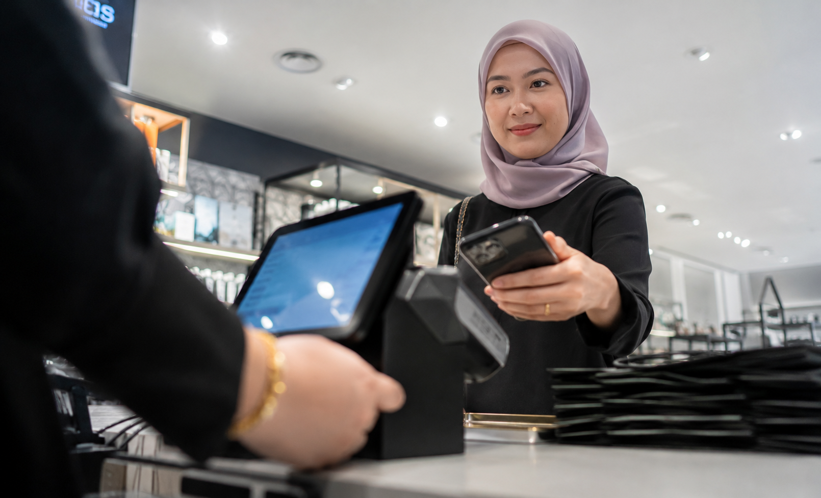 lady gives her phone to scan qr code